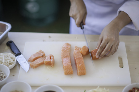 seafood chef slicing salmon fishのeditorial素材