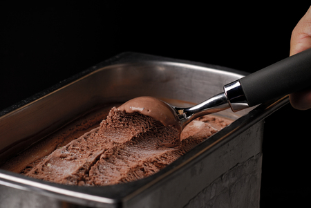 chocolate ice cream scoop trays black background1の写真素材