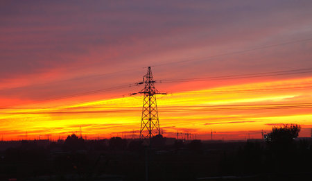 high voltage post at sunset  