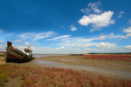 commercial fishing boats at anchor in a harbor quayside の写真素材