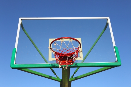A basketball hoop in the blue sky の写真素材