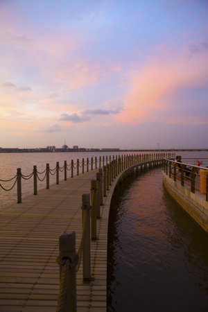 dusky sky and old wood bridge pier