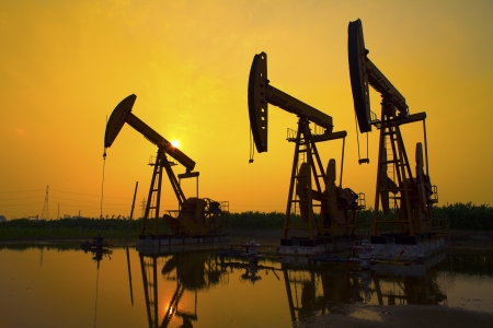Oil Pump on orange sunsetの写真素材