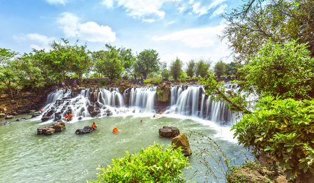 Dong Nai, Vietnam - March 1st, 2015: Panorama Giang Dien waterfall seen from above with water flowing white silk sheet as Into ladder on cliffs to bathing and relaxation Attract tourists on holiday in Dong Nai province, Vietnamのeditorial素材
