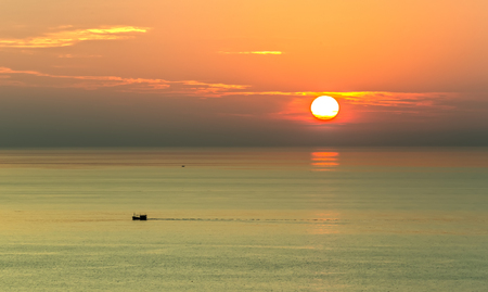 Boat sun leave behind streaks rolling dragon behave left unknown distant country to date to meet again from atmospheres of warm sea air Immense daysの写真素材