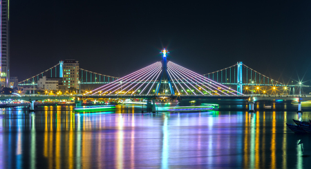 Han River Bridge and the Thuan Phuoc Bridge at night on the Han River flamboyance. It's great to watch the bridges at night. Danang attracts tourists each occasion trtong international fireworks competition.の素材 [FY31069533825]