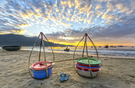 Da Nang, Vietnam, June 26, 2015: Double strickle, slippers expected to welcome the new day afar who Came back, this is vehicle for trafficking Fishermen fish in waters over simple, rustic but rich emotional meaning of lifeの写真素材