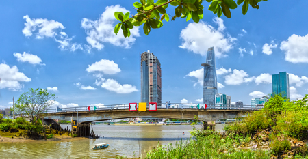 Ho Chi Minh City, Vietnam - April 10th, 2014: A boat to visit Saigon with skyscrapers inside the bridge on a summer morning in Ho Chi Minh City, Vietnamのeditorial素材
