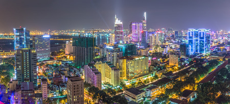 Ho Chi Minh City, Vietnam - August 6, 2015: Drawing beautiful urban architecture, impressive multi-colored light from the darkness down in District 1, Ho Chi Minh City, Vietnamのeditorial素材