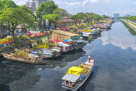 Ho Chi Minh City, Vietnam - January 26, 2017: Flowers at the flower market on canal wharf. This is place where farmers sell apricot blossom and other flowers on Lunar New Year in Vietnamのeditorial素材
