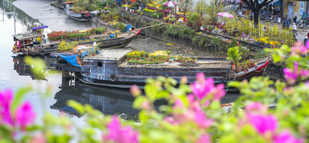 Ho Chi Minh City, Vietnam - January 26, 2017: Flowers at the flower market on canal wharf. This is place where farmers sell apricot blossom and other flowers on Lunar New Year in Vietnamのeditorial素材