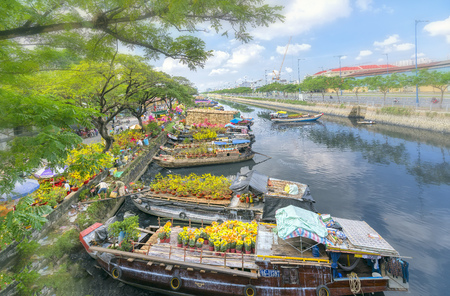 Ho Chi Minh City, Vietnam - January 26, 2017: Flowers at the flower market on canal wharf. This is place where farmers sell apricot blossom and other flowers on Lunar New Year in Vietnamのeditorial素材