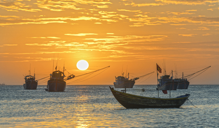 Mui Ne, Vietnam  Sunset at Fishing village and traditional fishing boats in Mui Ne, Vietnamの写真素材