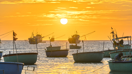 Sunset at Fishing village and traditional fishing boats in Mui Ne, Vietnamの写真素材
