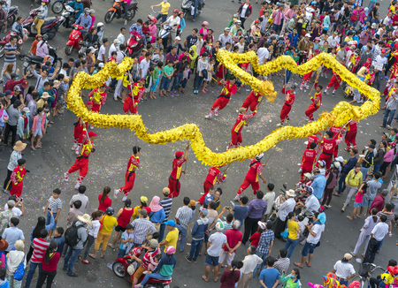 Binh Duong, Vietnam - February 11th, 2017: Dragon dance festival on the street with martial arts dragon winding control Practitioners of the Chinese Lantern Festival in Binh Duong, Vietnamのeditorial素材