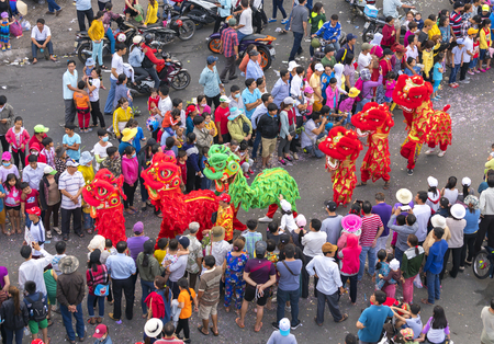 Binh Duong, Vietnam - February 11th, 2017: Chinese Lantern Festival with colorful dragons, lion, flags, cars, marched in the streets attracted crowd. This traditional festivals ethnic Chinese in Vietnamのeditorial素材