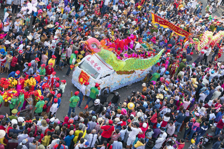 Binh Duong, Vietnam - February 11th, 2017: Chinese Lantern Festival with colorful dragons, lion, flags, cars, marched in the streets attracted crowd. This traditional festivals ethnic Chinese in Vietnamのeditorial素材