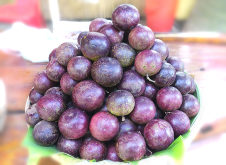Ripe purple star apple fruit is stacked for sale to consumersの写真素材