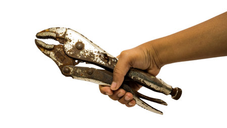 A hand of repairman holding pliers, on isolated, close-upの写真素材