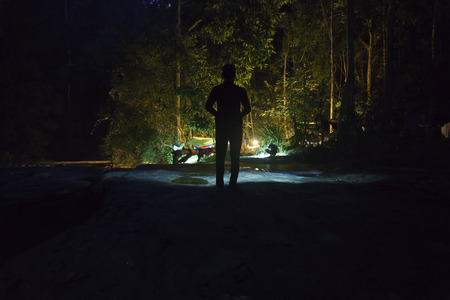 silhouette of man in dark atmosphereの写真素材