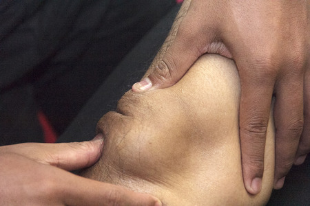 Sports massage - Arm massage - Physical therapist doing massage of arms. Toned image, selective focus set on hands.の写真素材