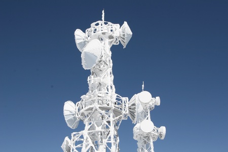 telecommunication tower in winterの写真素材