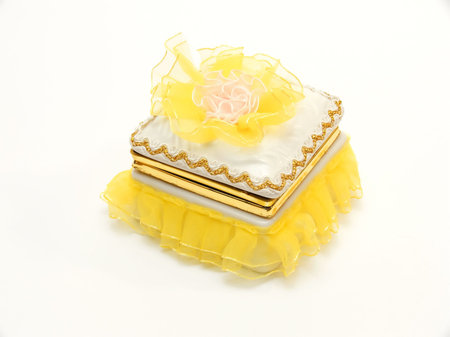 Yellow casket for storage of ornaments and jewelry