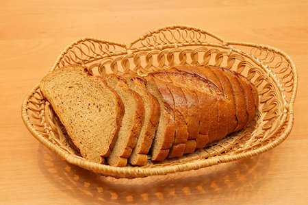 Cut loaf of rye bread on wum plate