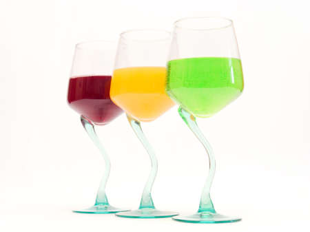 Three wine glasses with color drinksの写真素材