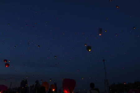 Starting celestial lanterns in the cityの写真素材
