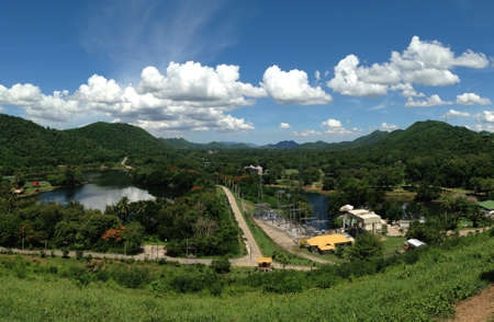 Power plant at dam with cloudy skyの素材
