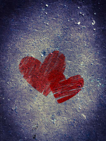 raw black concrete panel background or texture with a couple of red heartの写真素材