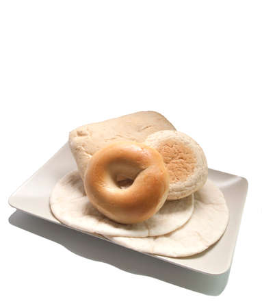 various types of bread in a plate on white backgroundの写真素材