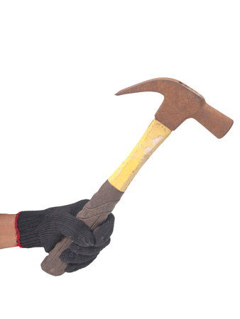 hammer in a hand with black gloveの写真素材