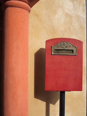 red mailbox on fresco wall backgroundの写真素材