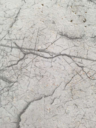 raw concrete panel background with crackの写真素材
