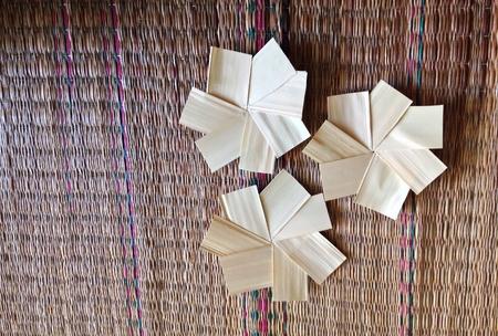 handicraft from nature in flower shape on mat backgroundの写真素材