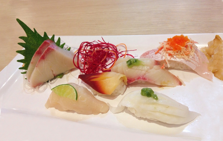 japanese sushi or sashimi in ice bowl or plate with leafの写真素材