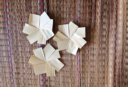 handicraft from nature in flower shape on mat backgroundの写真素材