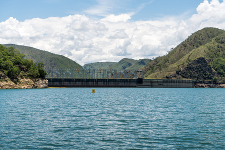View from behind the floodgates of an electric power damの写真素材