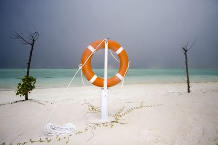 Life guard ring at stormy seaの写真素材