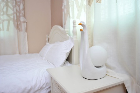 King sized bed in a business hotel room.の写真素材