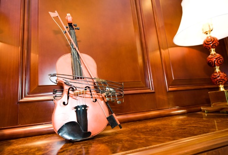 A violin on the cabinet, taken at home.の写真素材