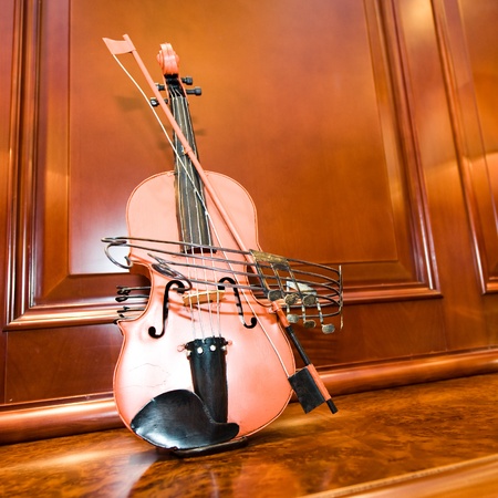 A violin on the cabinet, taken at home.の写真素材