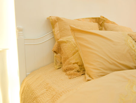 Image of comfortable pillows and bed.の写真素材