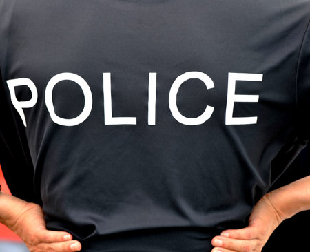 The back of a police officers .