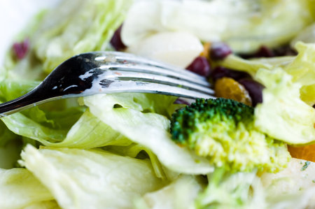 Bowl of salad on a plate.