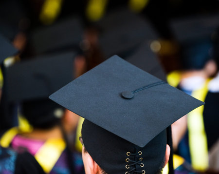 Shot of graduation caps during commencement.