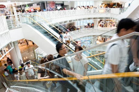 People in motion in escalators at the modern shopping mall. のeditorial素材