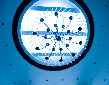 blue toned shot of round ceiling with beautiful crystal chandelier.の写真素材
